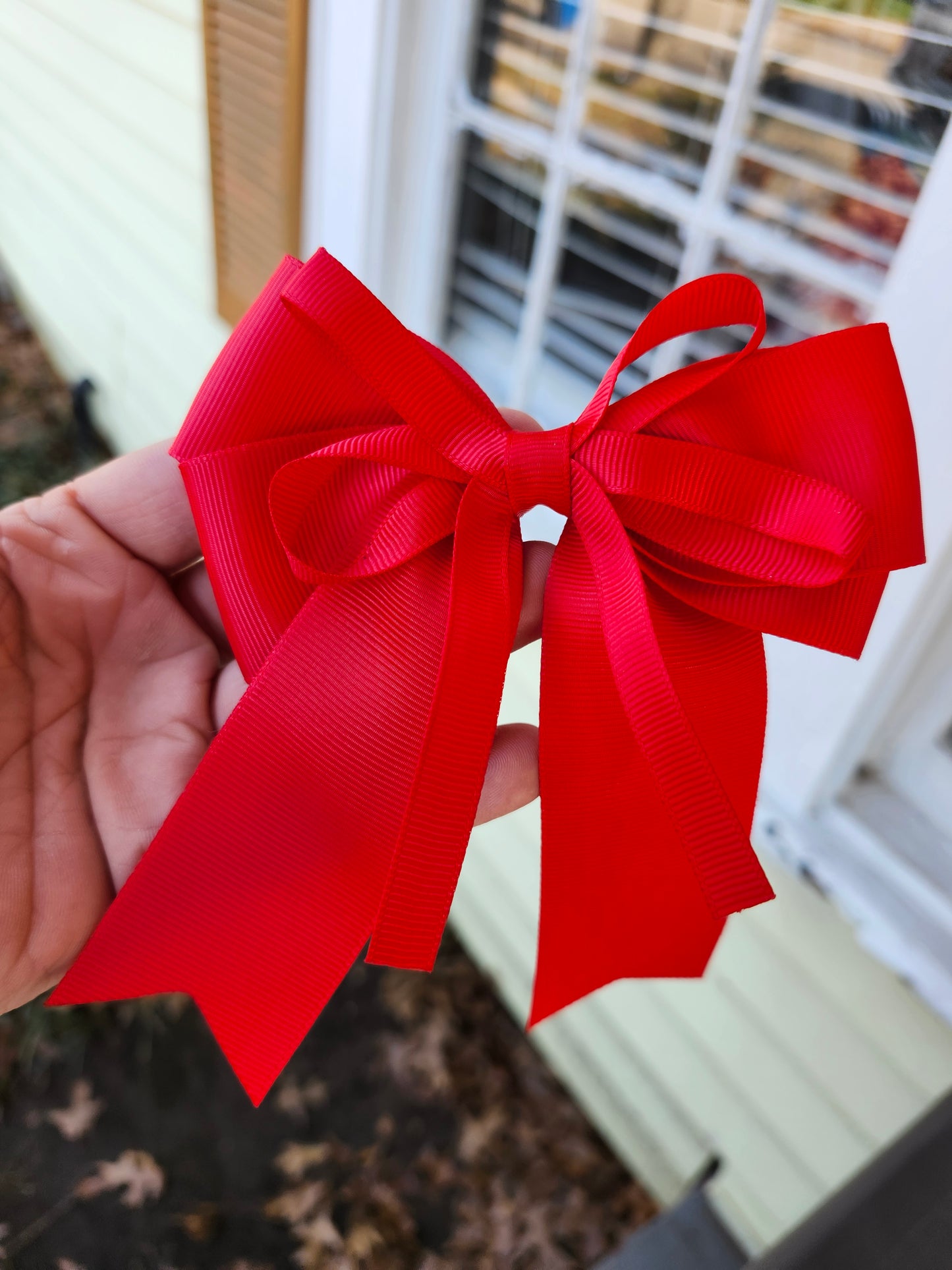 Small red cheer bow