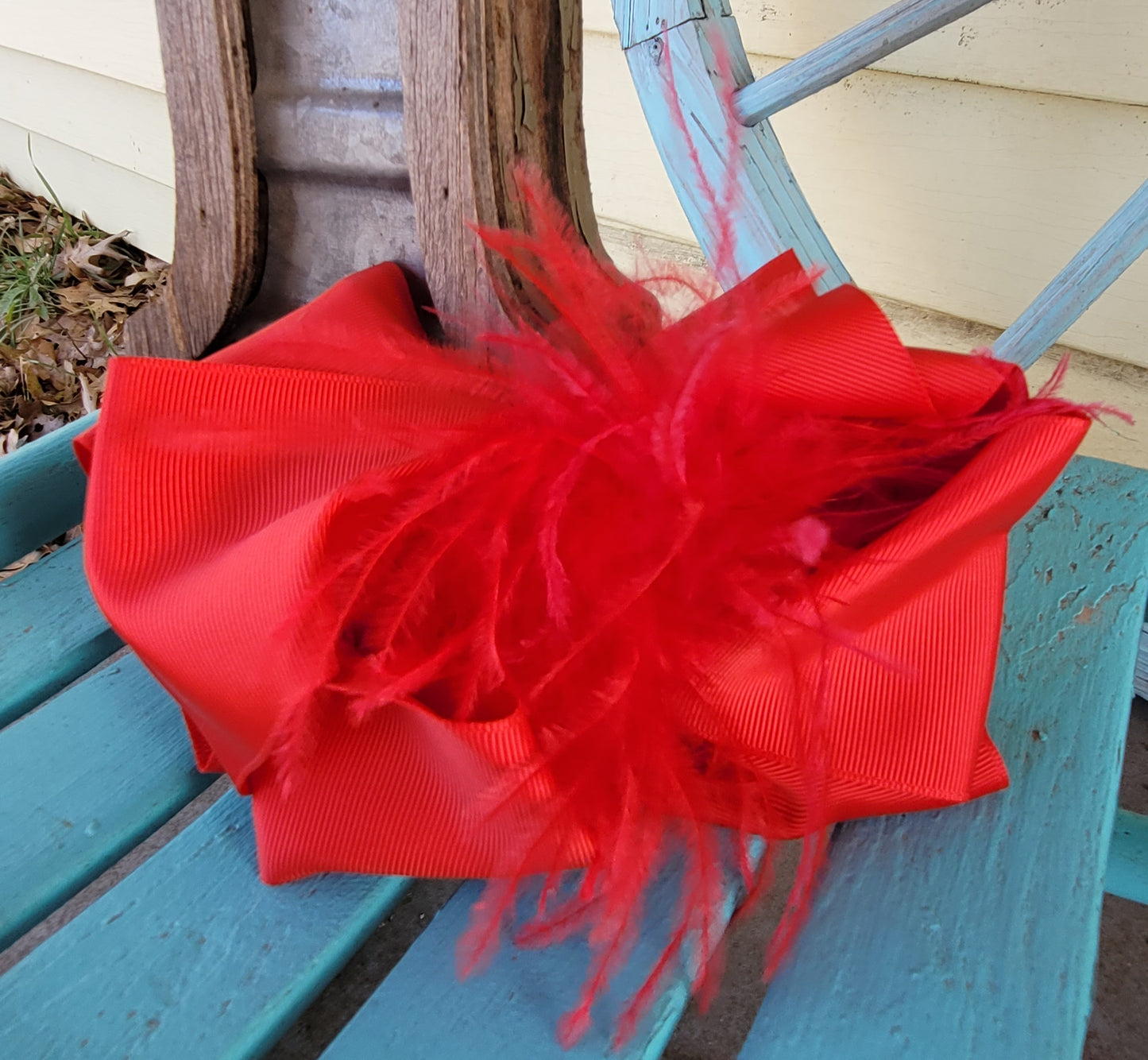 Poppy red feather bow