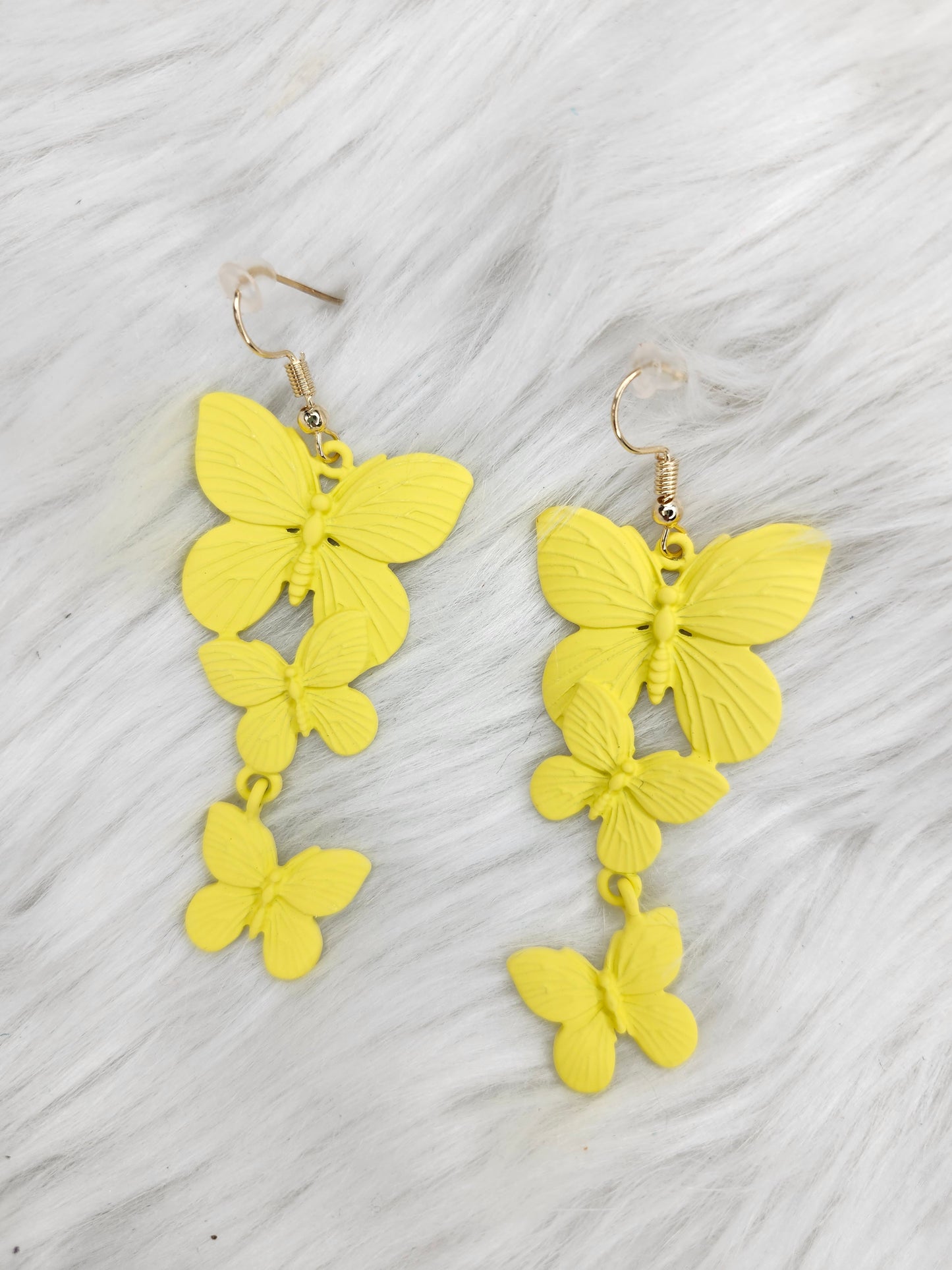 Yellow metal butterflies earrings