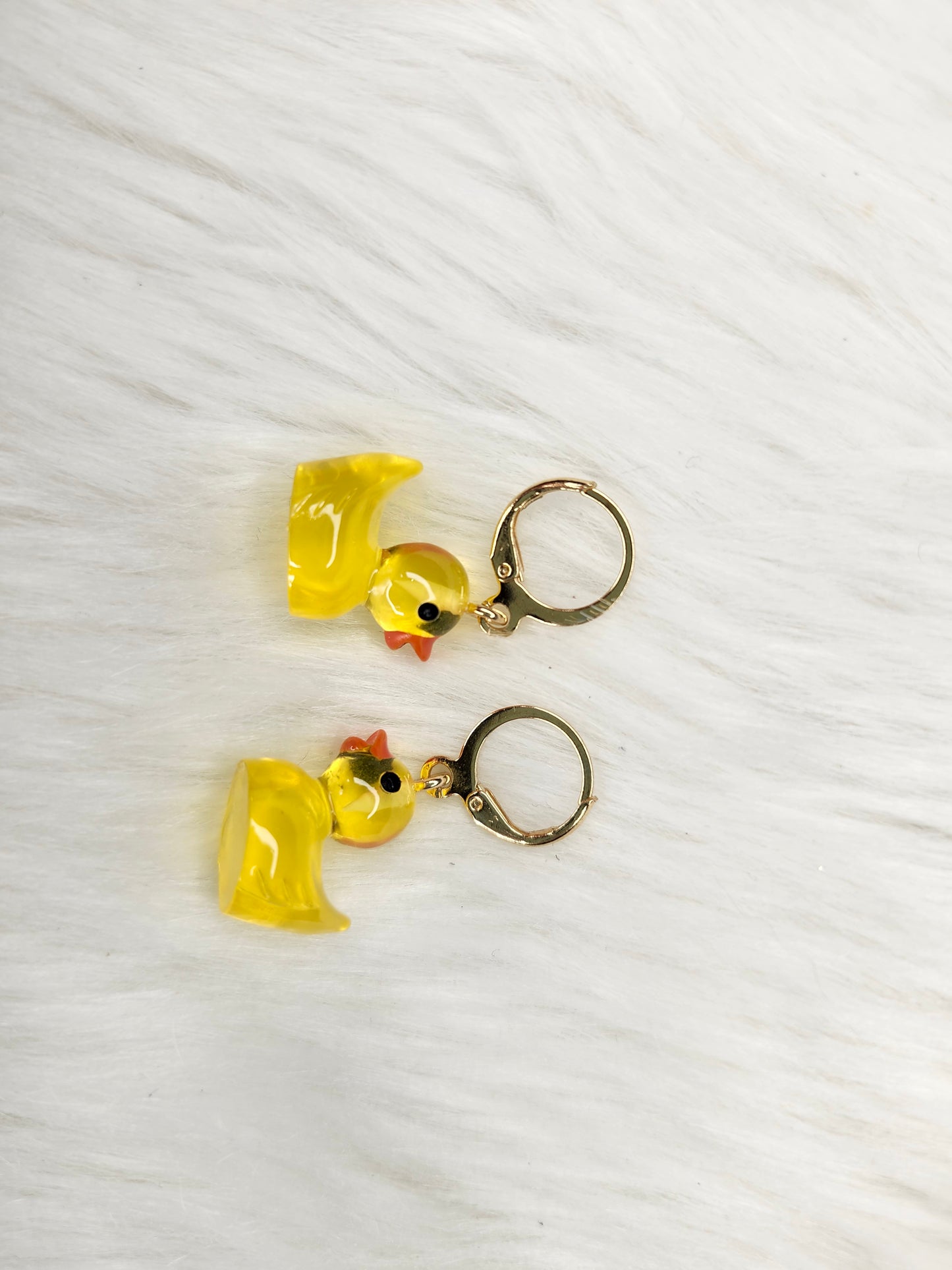 See threw yellow duck earrings