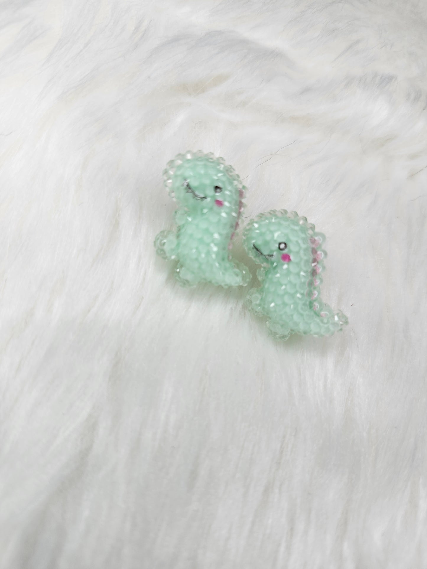 Green dinosaur earrings