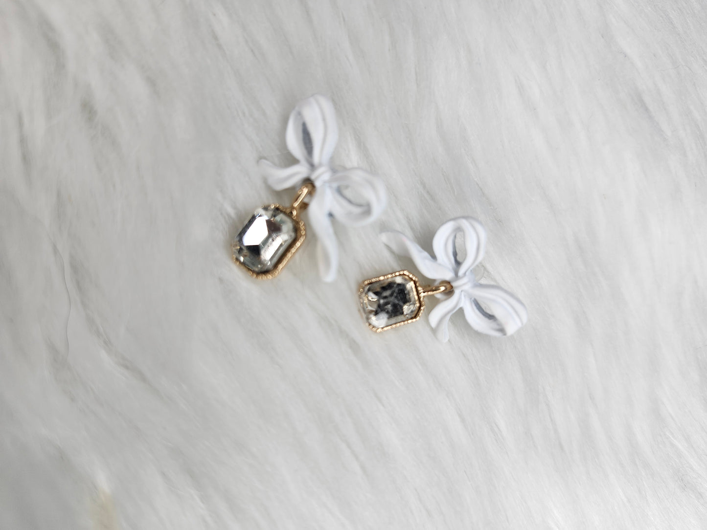 White bow earrings