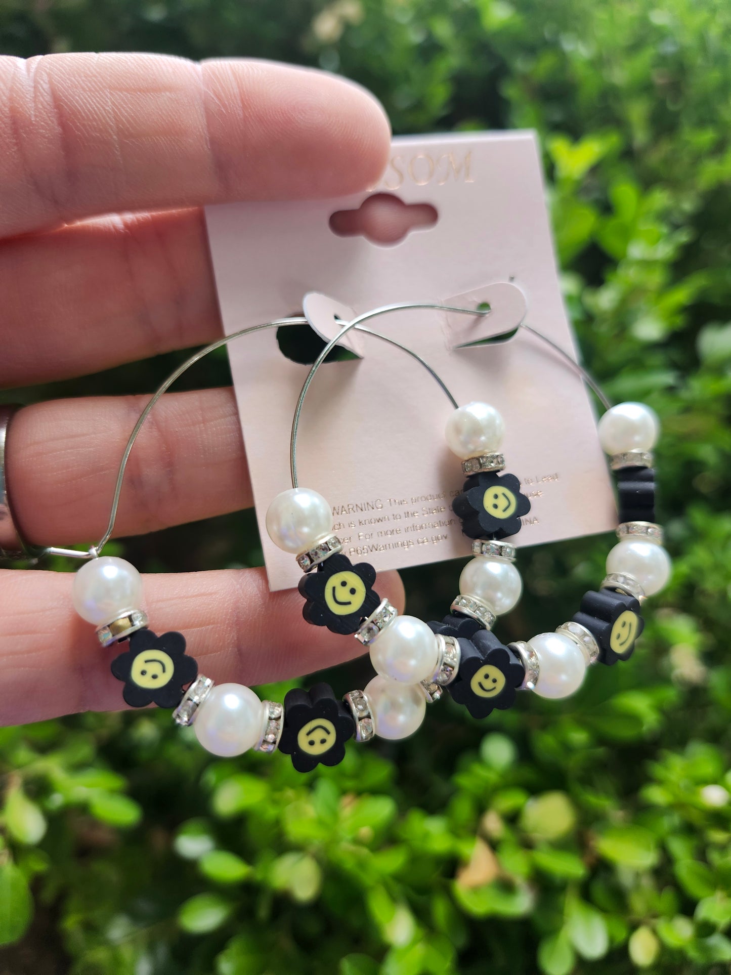 Black smiley flower earrings