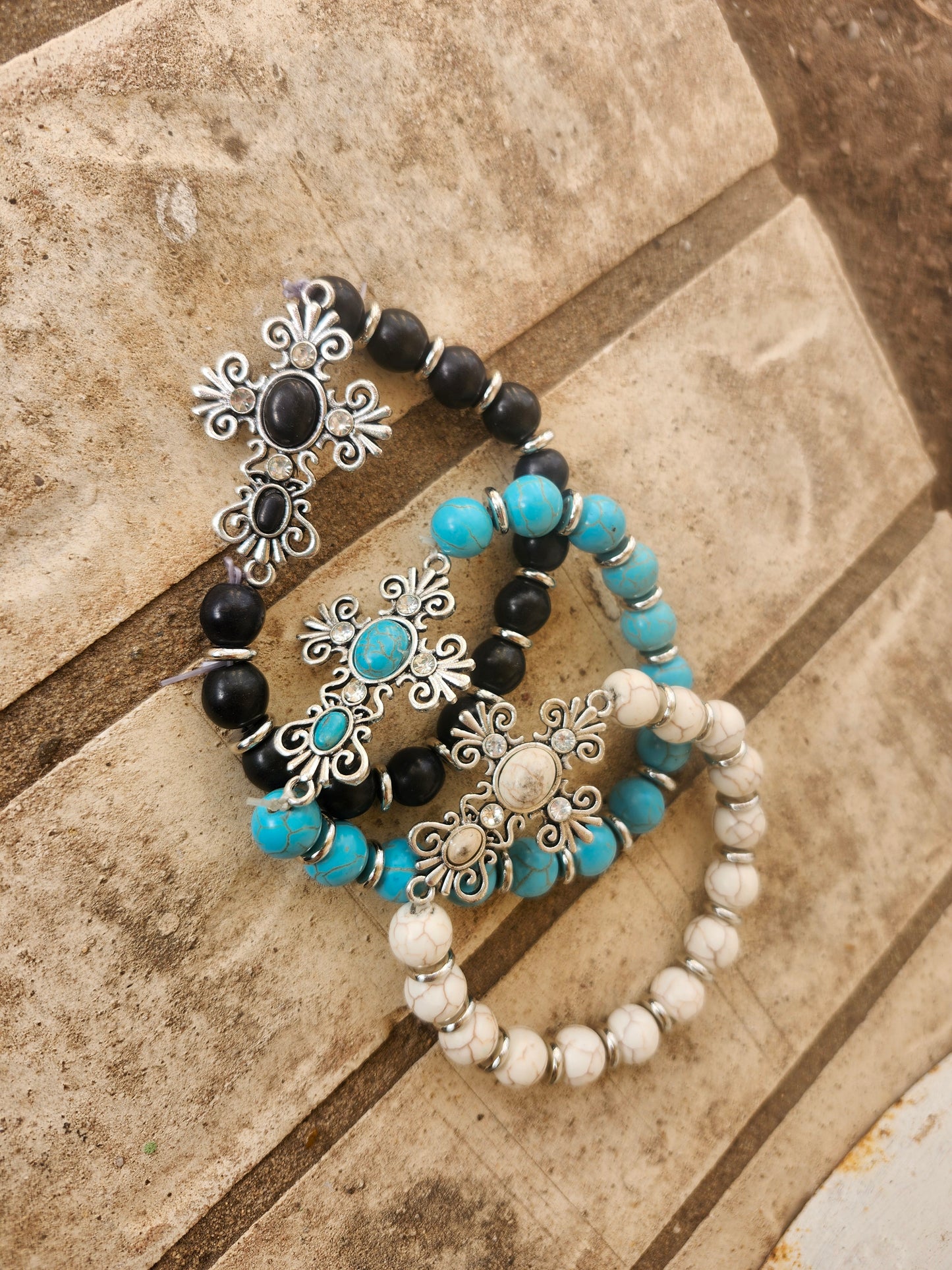 Cross bracelets.