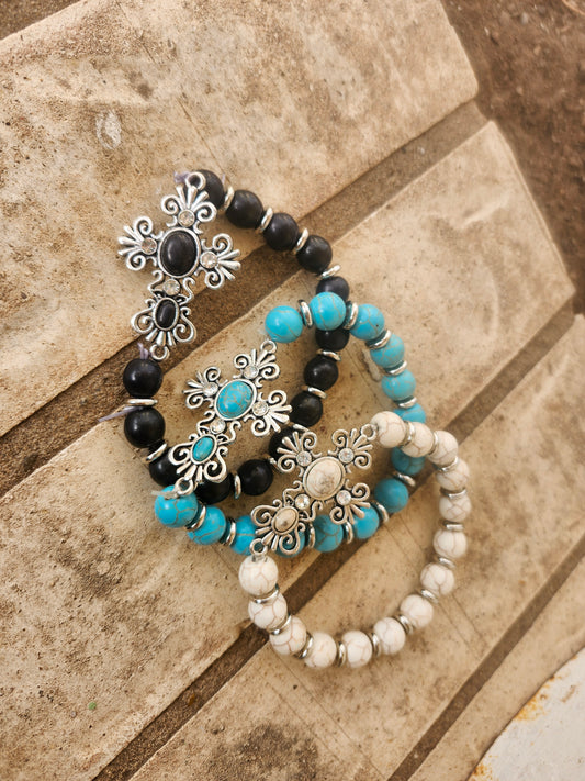 Cross bracelets.