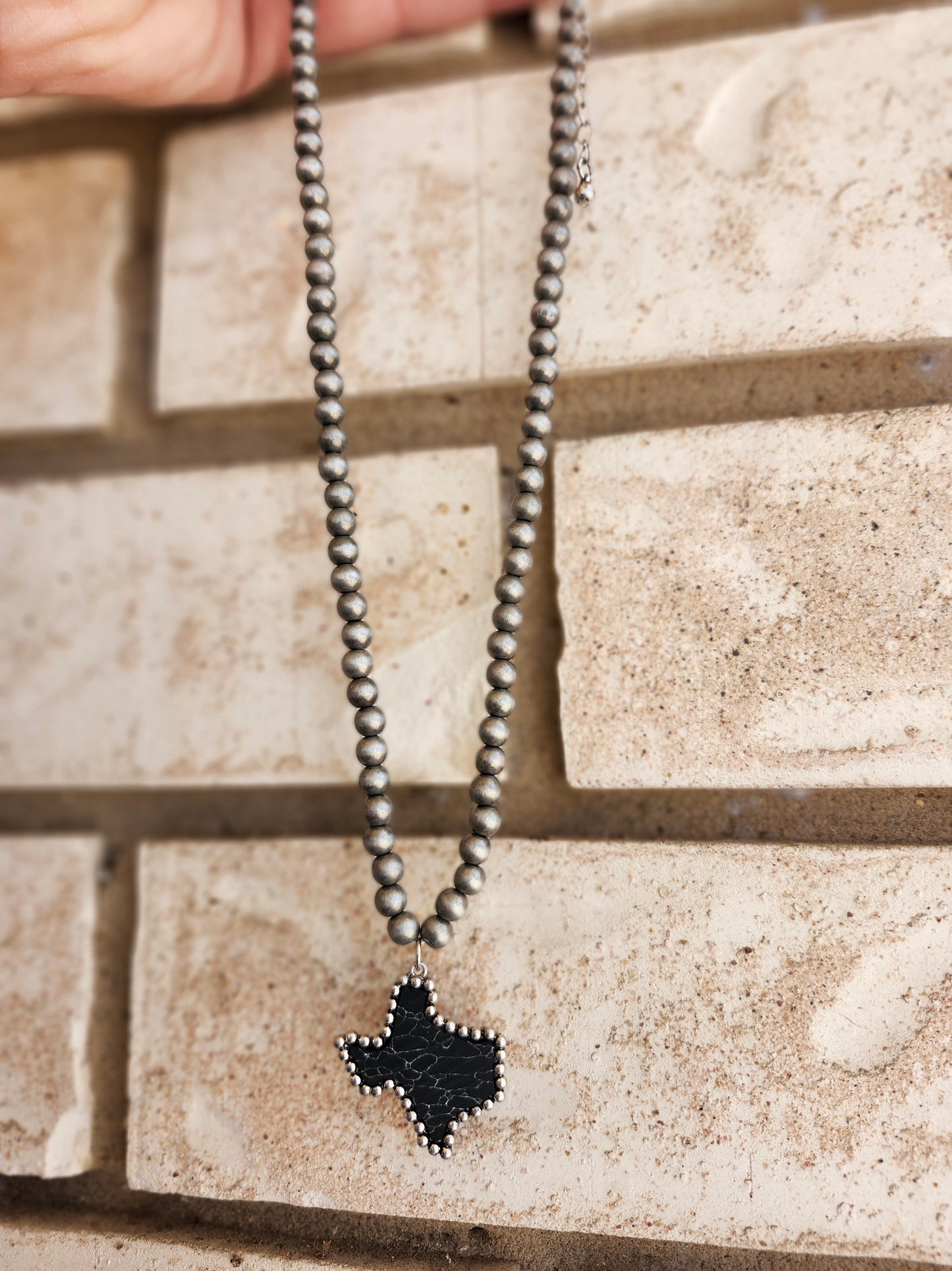Black tx necklace