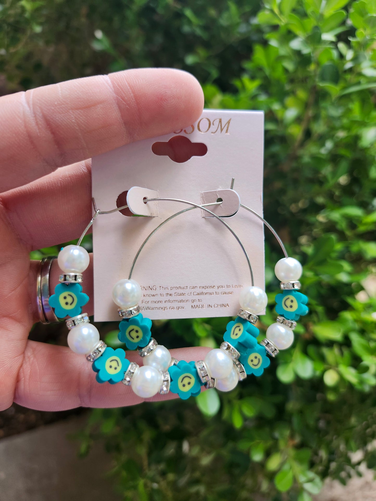 Teal smiley flower earrings