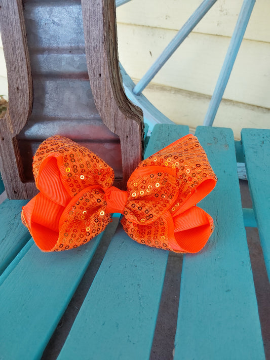 Coral ribbon seqquin bow