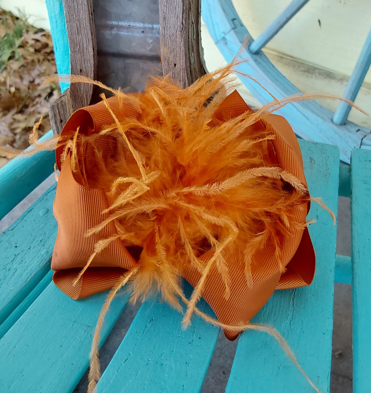 Burnt orange feather bow