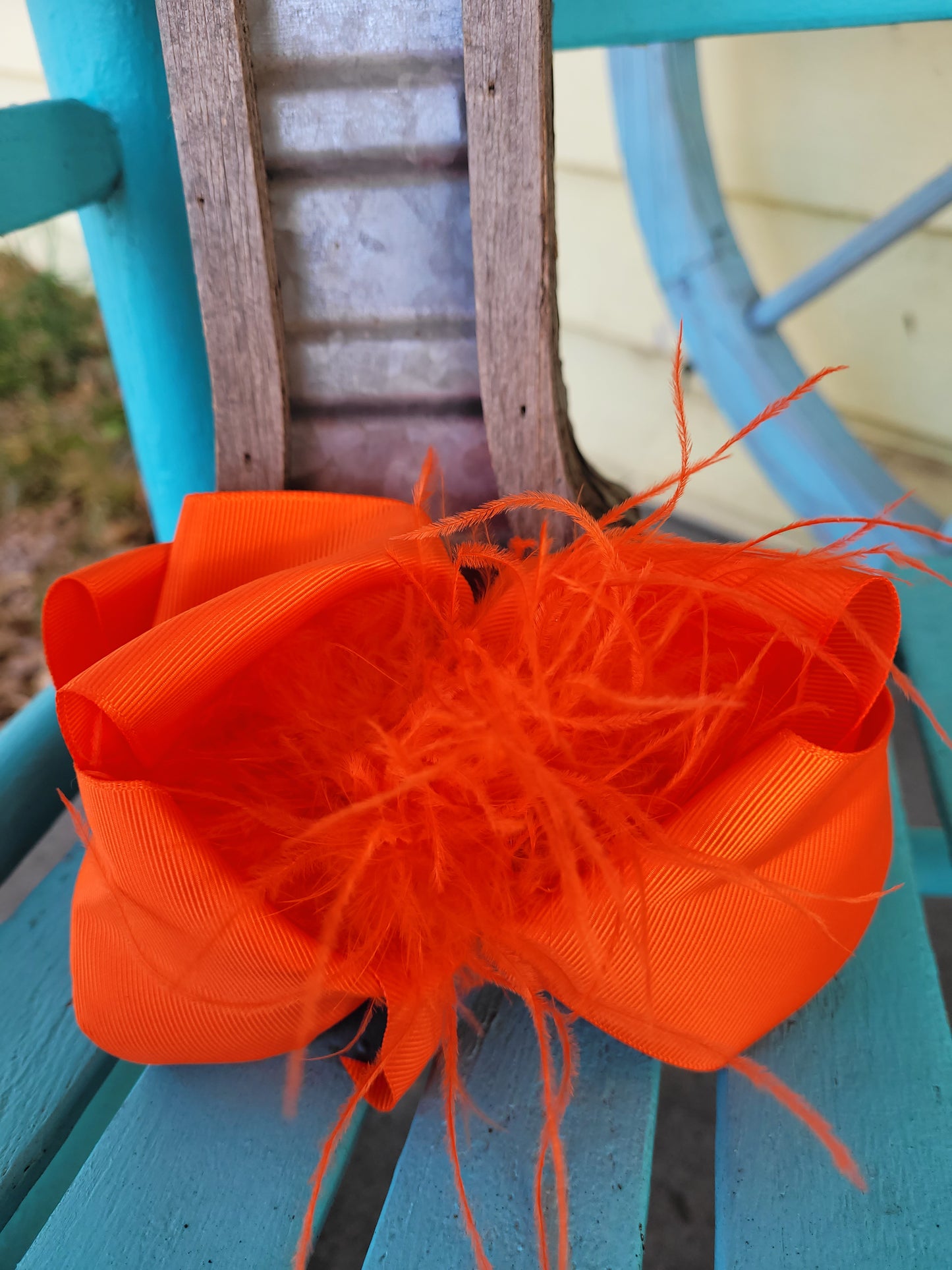 Orange feather bow