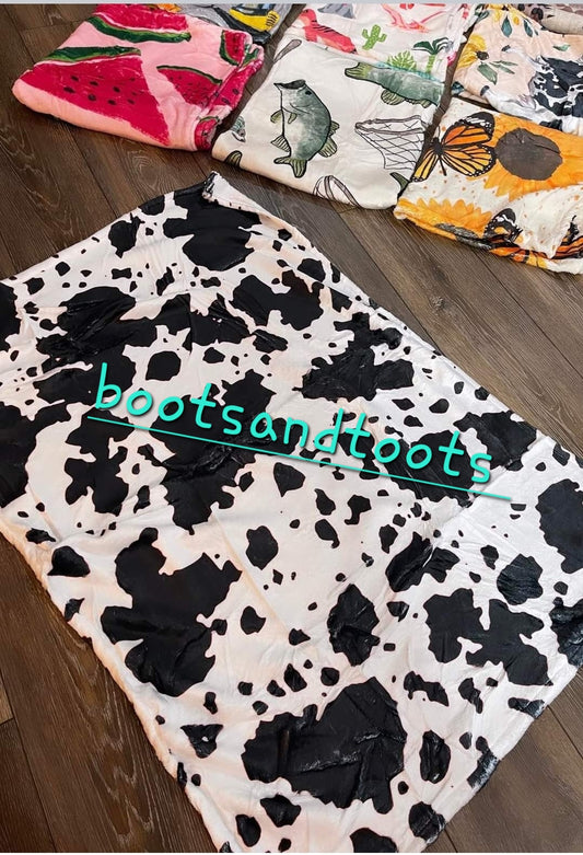 Black and white cow blanket